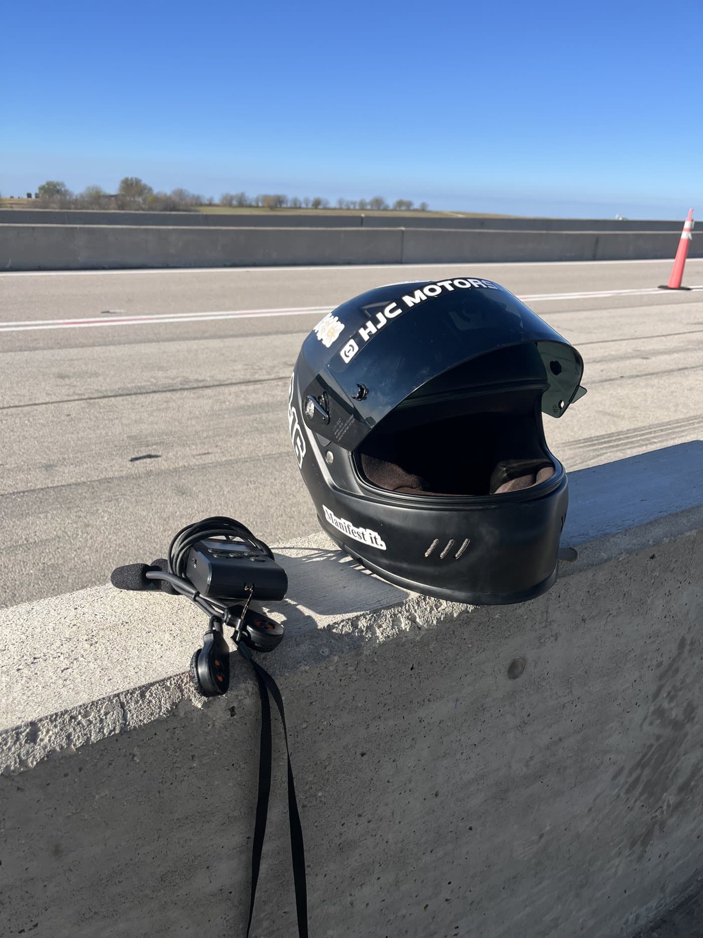 Helmet and gear trackside between sessions at Motorsport Ranch Cresson