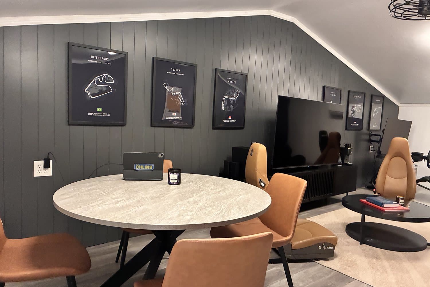 The Senna Lounge — circuit prints, a screen for video review, and seating for debriefs between sessions