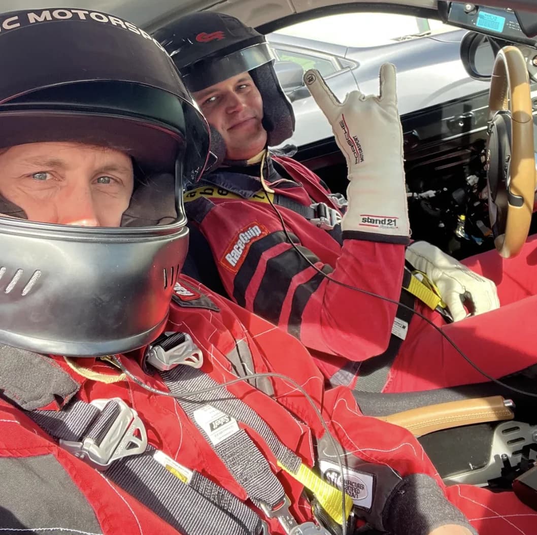 Jon-Eric Fountain in racing gear with a driver at Motorsport Ranch Cresson