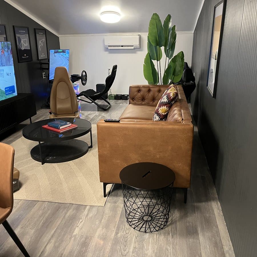 Senna's Lounge with a simulator rig and a screen showing track footage