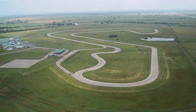 Aerial view of Motorsport Ranch Cresson — track configurations, garages, and clubhouse on 300+ acres